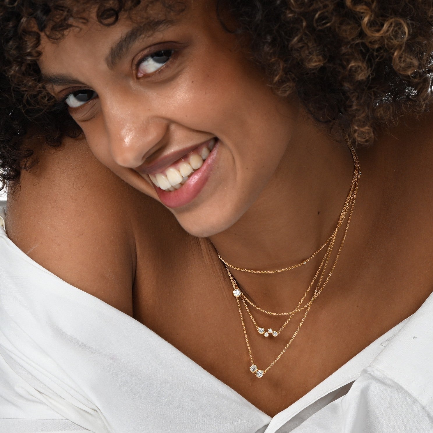 Model wearing lab-grown diamond necklaces.