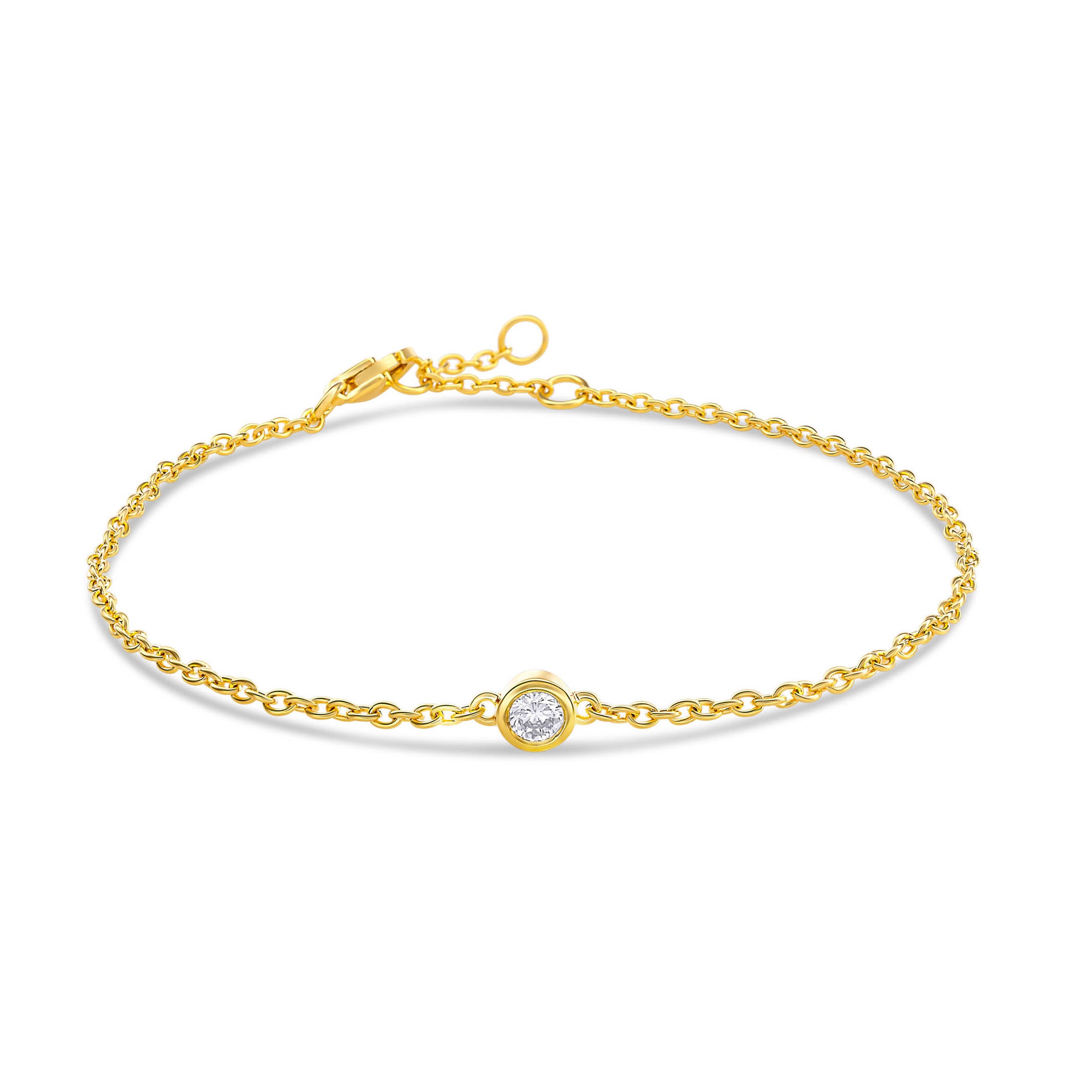 Eine vergoldete Armkette besetzt mit einem einzelnen runden Labordiamanten im Brillantschliff